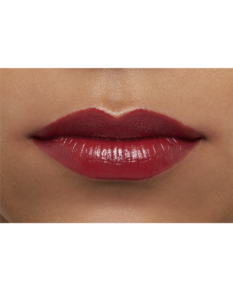 Photo of a deep skin tone model  wearing  "LIPSTICK" in Pink Larkspur on the lips.