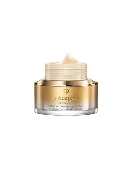 Photo of the smooth, rich texture of RESTORATIVE CREAM SUPREME, shown as a pale, glossy, creamy teardrop-shaped swatch.