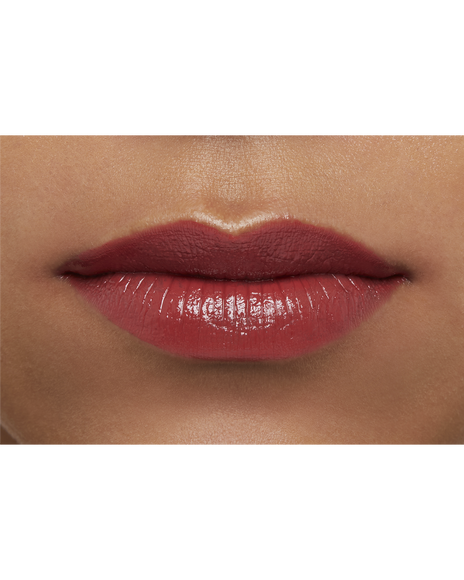 Photo of a deep skin tone model  wearing  "LIPSTICK" in Whispering Rosewood on the lips.