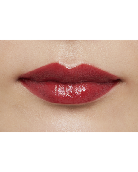 Photo of a medium skin tone model  wearing "LIPSTICK" in Pink Larkspur on the lips.