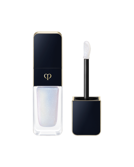 Photo of CREAM ROUGE SPARKLES with a blue-black cap engraved with the brand logo and a transparent body. The cap includes an applicator with a precision tip. SHADE: 301