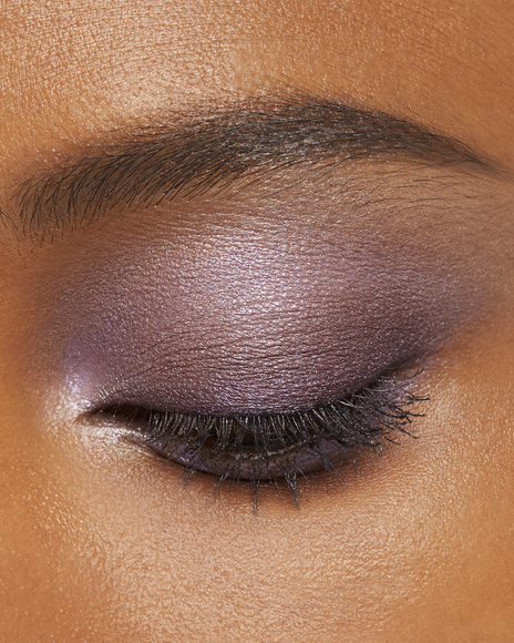 Photo of a deep skin tone model wearing EYE COLOR QUAD in 13-Sunwarmed Stonest on the eyes.