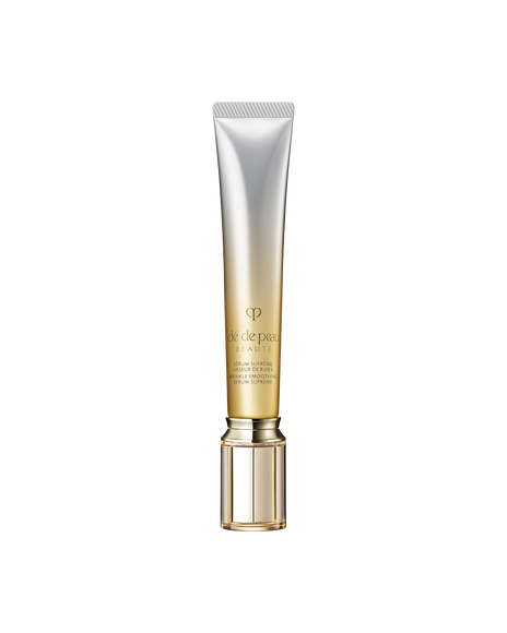 Photo of a WRINKLE SMOOTHING SERUM SUPREME in a tube-shaped package with a clear cap and a gradient from silver at the top to gold at the bottom.