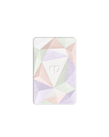 Photo of the refill for the highlighter powder designed with lavender, light green, and beige pink geometric patterns. The brand logo is engraved in the center. Shade: 17-Celestial Sparks.