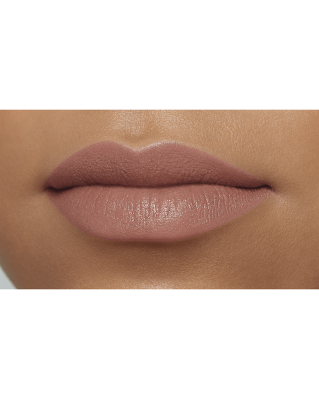 Photo of a deep skin tone model wearing CREAM ROUGE MATTE in shade 111 on the lips.