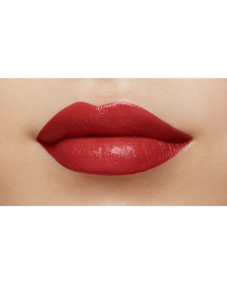 Photo of a medium skin tone model  wearing "LIPSTICK MATTE" in High Achieve on the lips.