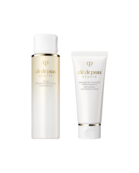 Photo of the mini set of &ldquo;CLEANSING OIL&rdquo; and &ldquo;SOFTENING CLEANSING FOAM.&rdquo; On the left is a 75mL cleansing oil in a bottle with a gold gradient and a white cap; on the right is a 40g softening cleansing foam in a white tube.