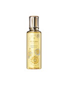 Photo of the 26 SS Gift Collection limited-edition HYDRO-SOFTENING ESSENCE LOTION. The golden-toned bottle features the Radiance Fireworks design with flowers blooming like fireworks and a key motif. 