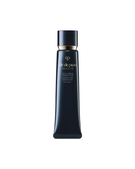 Photo of the "CORRECTING CREAM VEIL" in a glossy deep navy slender tube adorned with a gold logo and cap.