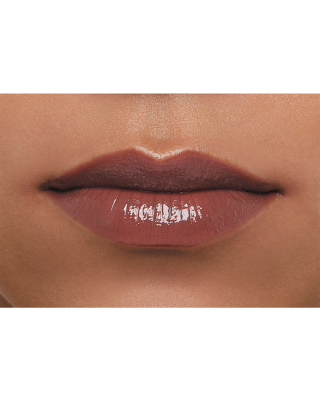 Photo of a dark skin tone model wearing LIPSTICK SHINE 219 in Transcendent on the lips.