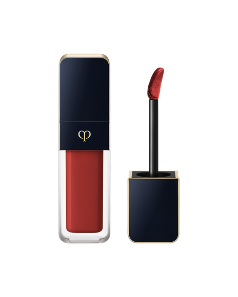 Photo of "CREAM ROUGE SHINE", with a blue-black cap engraved with the brand logo and a clear body. The cap comes with a stick with a tip attached. SHADE: 205.