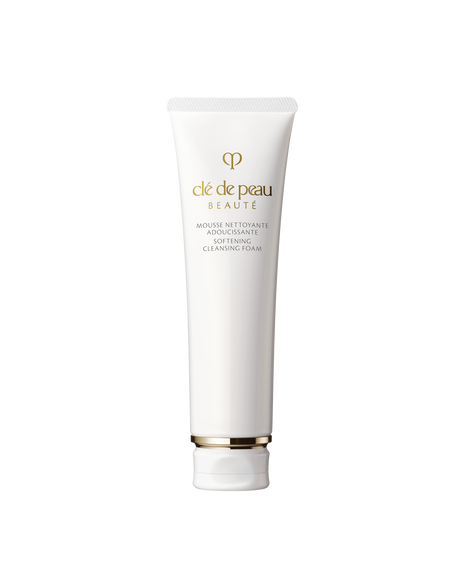 Photo of a white tube of &ldquo;SOFTENING CLEANSING FOAM.&rdquo; Gold brand logo and product name are printed on the front. The cap features gold detailing. Size: 140g.