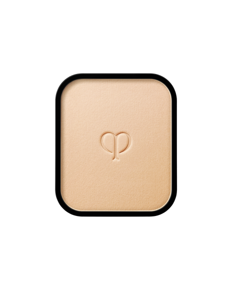 Photo of a refill of "RADIANT POWDER FOUNDATION" with an embossed brand logo in the center. SHADE: I10.