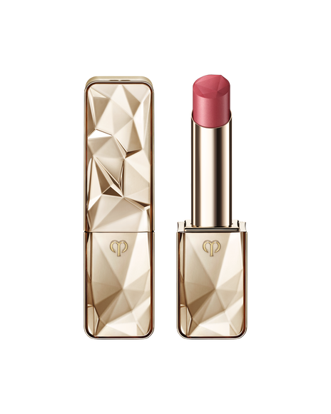 Photo of "THE PRECIOUS LIPSTICK", featuring a sparkling gold case and cap that reflects light. SHADE:Charming Pink Sapphire.
