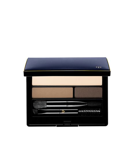 Photo of "EYEBROW AND EYELINER COMPACT". The compact contains three shades of powder, along with a brush, a spoolie brush, and an applicator tip. The lid is blue-black with a gold-engraved brand logo. Shade: 2-YE-BR.