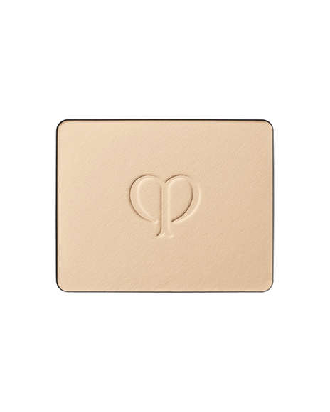 Photo of a refill of "BRIGHTENING POWDER FOUNDATION" with an embossed brand logo in the center. SHADE: I10.