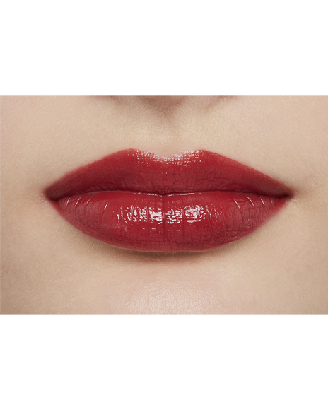 Photo of a light skin tone model  wearing  "LIPSTICK" in Pink Larkspur on the lips.