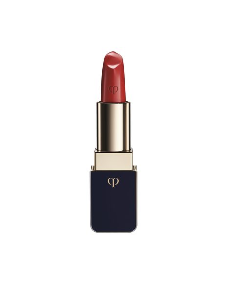 Photo of "LIPSTICK" with the stick twisted up. The tip is engraved with the brand logo, and the body features a combination of blue-black and gold sides. SHADE: Camellia.