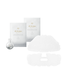 Photo of BRIGHTENING MASK TREATMENT SUPREME, showing two silver sheet mask packets for upper and lower face, a small faceted white exfoliating gel package on the left, and two unfolded white sheet masks.