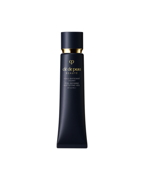 Photo of "PORE-REFINING MATTIFYING VEIL", in a slim blue-black tube accented with a reflective gold cap and the brand logo.