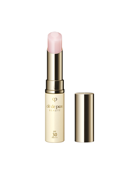 Photo of the "PROTECTIVE LIP TREATMENT" in a sleek gold tube with a soft pink balm stick and matching cap. SIZE: 4g