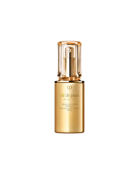 Photo of "PRECIOUS GOLD VITALITY SERUM", featuring a glossy gold bottle paired with a thick, translucent cap. The front displays the brand logo and product name in an elegant design.