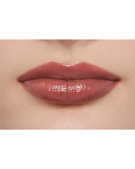 Photo of a light skin tone model wearing LIPSTICK SHINE 219 in Transcendent on the lips.