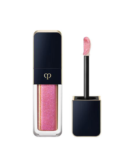 Photo of "CREAM ROUGE SPARKLES", with a blue-black cap engraved with the brand logo and a transparent body. The cap includes an applicator with a precision tip. SHADE: 304.