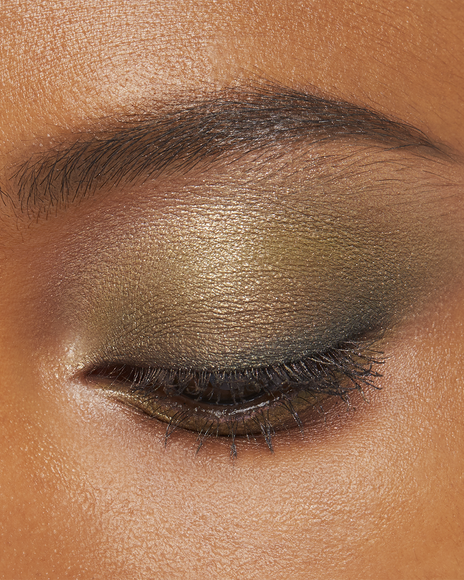 Photo of a deep skin tone model wearing EYE COLOR QUAD in 10-Sea Gras on the eyes.