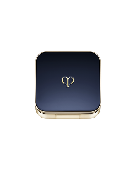 Photo of an exclusive case for "EYE COLOR SOLO" with the lid closed. It has a rounded square shape, with a blue-black lid featuring the brand logo in the center and gold trim along the sides.