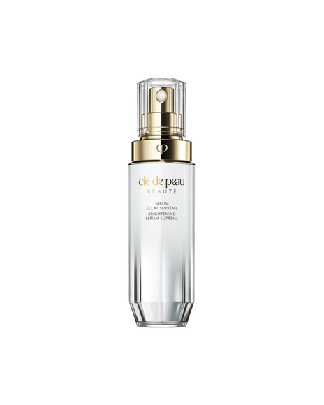 Photo of "BRIGHTENING SERUM SUPREME," a brightening serum in a faceted bottle with a pearl-white to silver gradient, gold dispenser, and clear cap. SIZE:40mL