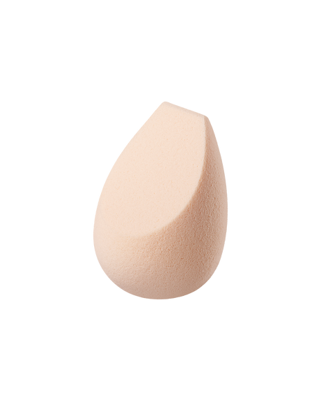 Photo of &ldquo;THE SPONGE.&rdquo; It is teardrop-shaped with a slanted tip and a fine texture.