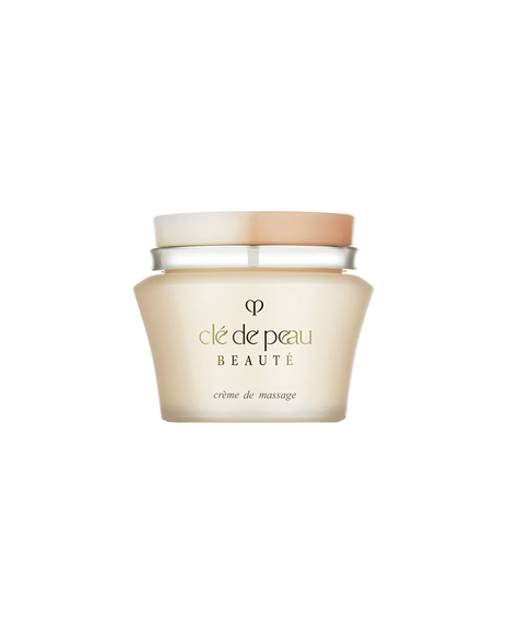 Photo of "MASSAGE CREAM" in a pale gold glass jar with a two-tone beige and white lid. The gold brand logo and product name are printed on the front.