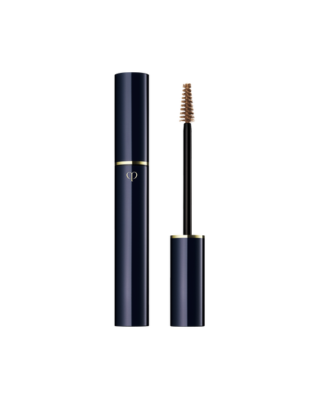 Photo of "EYEBROW GEL". The slim blue-black body is engraved with the gold brand logo, and the cap has a brush attached to iy. Shade: 101-Auburn.