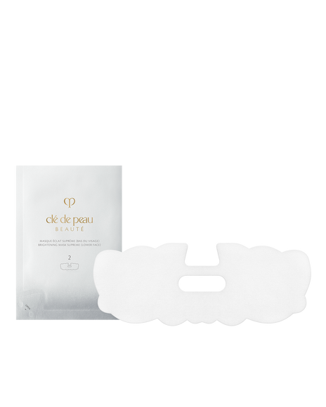 Photo of BRIGHTENING MASK TREATMENT SUPREME lower face sheet mask (step 2). A silver packet and a white lower face mask with a central mouth opening are shown side by side.