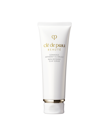 Photo of a white tube container of &ldquo;SKIN-REFINING CLAY SCRUB&rdquo;, with brand logo and product name printed in gold on the front.