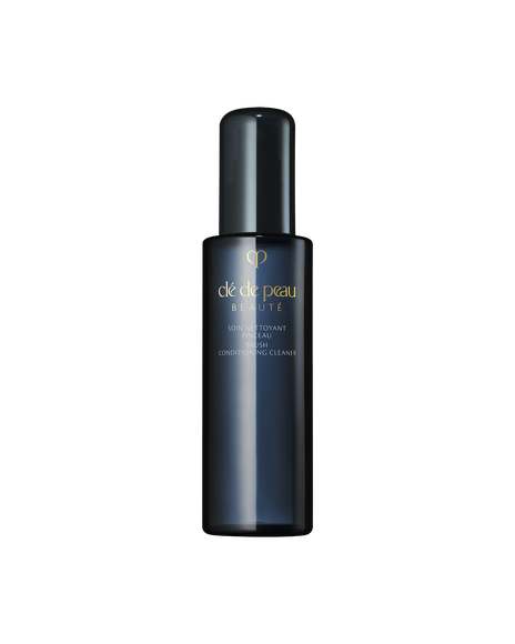 Photo of "BRUSH CONDITIONING CLEANER", which comes in a translucent blue-black bottle engraved with the gold brand logo.