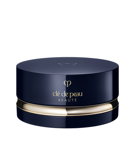 Photo of a luxurious round container in blue-black and gold. The lid is closed, and the brand logo is engraved on the top.
