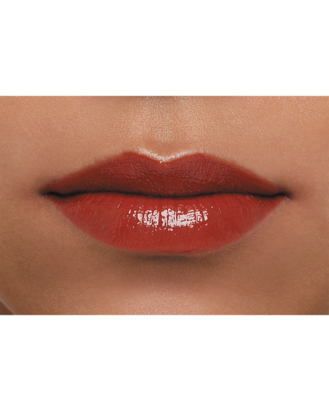 Photo of  a dark skin tone model  wearing  LIPSTICK SHINE 218 in Transcendent on the lips.