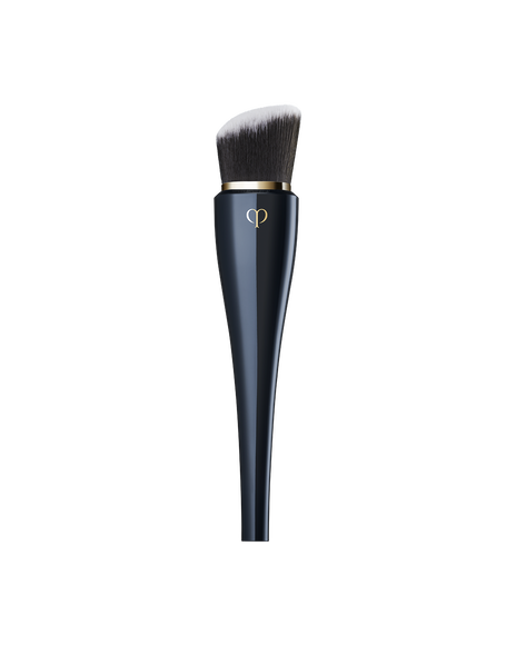 Photo of &ldquo;HIGH COVERAGE FOUNDATION BRUSH&rdquo; featuring a sleek, blue-black handle with a gold brand logo, and dense, slanted bristles.