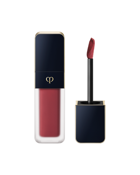 Photo of "CREAM ROUGE MATTE", with a translucent body and a blue-black cap engraved with the brand logo. The cap comes with a stick with a tip attached. SHADE: 114.
