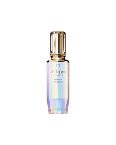 Photo of "THE SERUM" bottle with an iridescent finish and a rounded, translucent gold cap. SIZE : 75ml