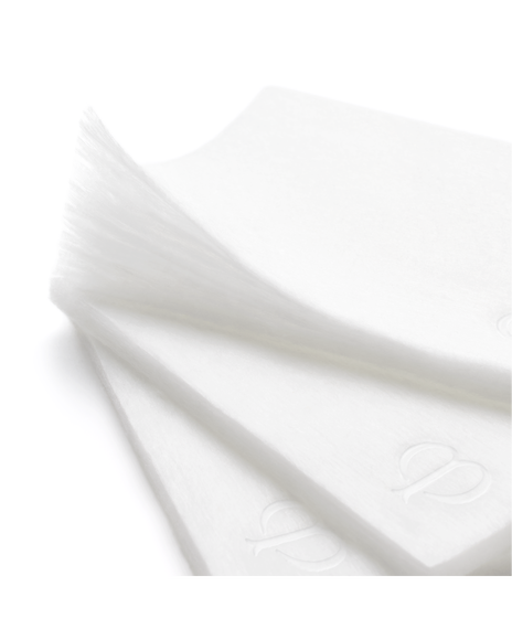 Close-up photo of COTTON pads embossed with the brand logo.