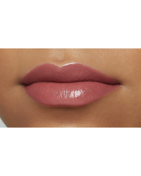 Photo of the lips of a model with a deep skin tone wearing "LIPSTICK" in the shade Power Mauve.