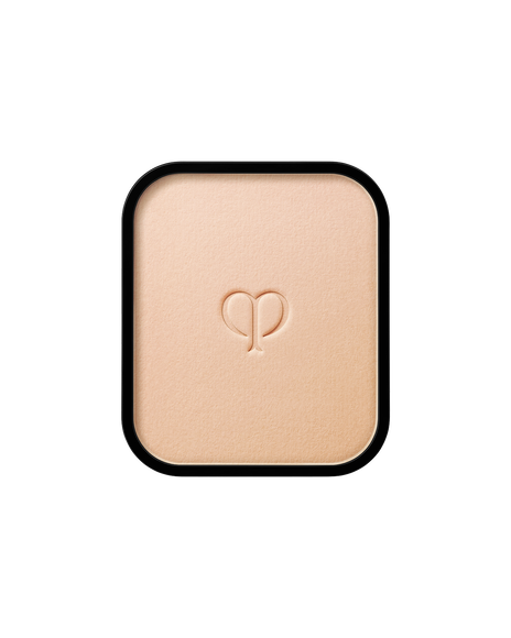 Photo of a refill of "RADIANT POWDER FOUNDATION" with an embossed brand logo in the center. SHADE: B00.