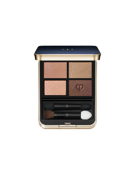 Photo of "EYE COLOR QUAD (REFILL)" set in a square case with a blue-black top and gold brand logo. Includes tip and brush. Shade: 5-Coral Reef.