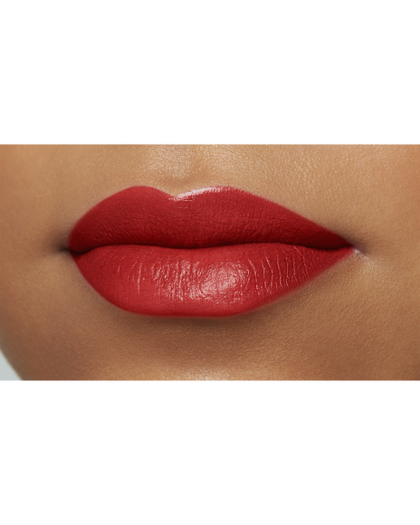 Photo of a deep skin tone model  wearing "LIPSTICK MATTE" in High Achieve on the lips.