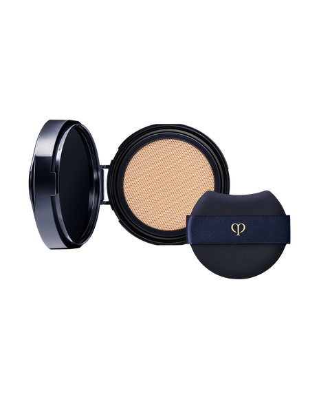 Photo of an open "RADIANT CUSHION FOUNDATION NATURAL (Refill)" compact with a branded puff. SHADE: O20