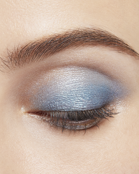 Photo of a light skin tone model wearing EYE COLOR QUAD in 11-Azure Blue Seat on the eyes.