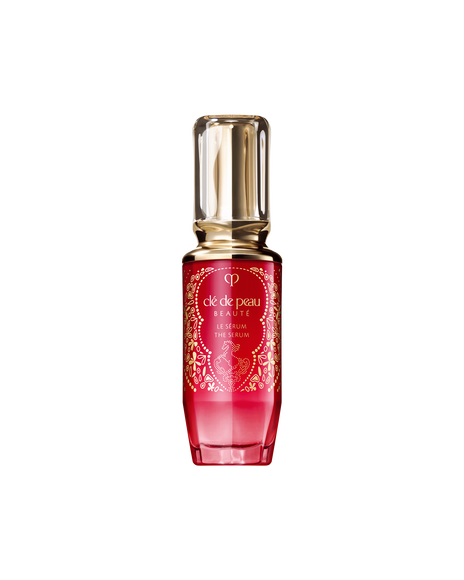 Photo of the 2026 Lunar New Year limited-edition THE SERUM bottle featuring a design by artist Jiang Miao. The vibrant red bottle is decorated with dynamic gold line art of a horse and a Dang Lu ornament motif, symbolizing good fortune.